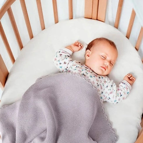 caption- baby sleeping in Stokke Mini Bundle