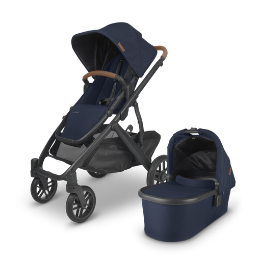 caption-Navy Fabric with Saddle Leather UPPAbaby Stroller and included Bassinet