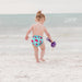 caption-Watermelon Swim Diaper by AMP Diapers on baby at beach
