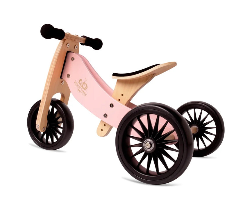 Rose Pink wooden tricycle to balance bike shown with three wheels and adjustable seat