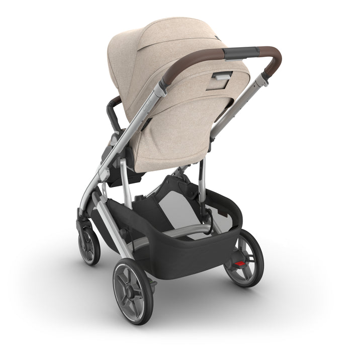UPPAbaby Cruz V3 Declan beige stroller with black basket detailing on a white background