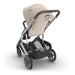 UPPAbaby Cruz V3 Declan beige stroller with black basket detailing on a white background