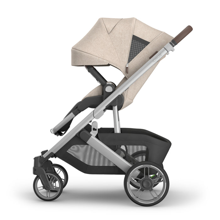 Stroller with beige canopy on a white background