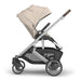 Side View of UPPAbaby Cruz V3 stroller with Declan beige canopy on a white background