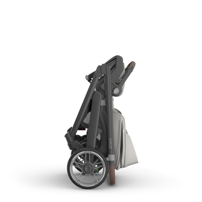 Folded UPPAbaby Cruz V3 stroller on a white background