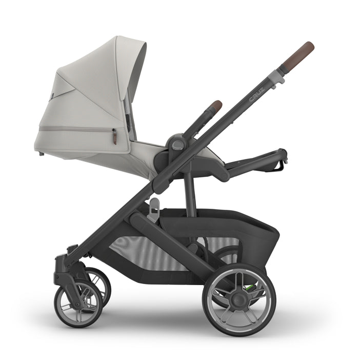 UPPAbaby Cruz V3 Stroller reclined with a Savannah gray canopy on a white background