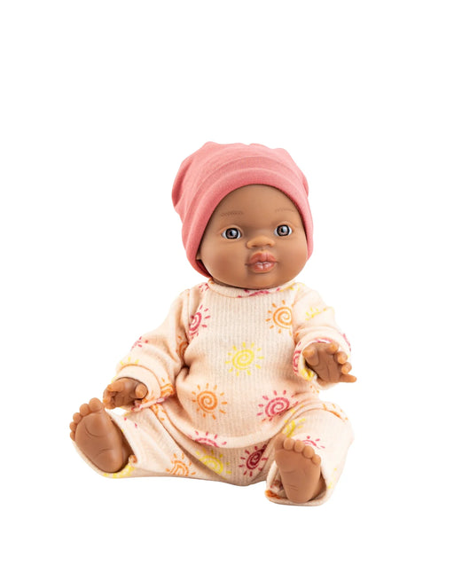 Baby doll with pink hat and patterned outfit on a white background