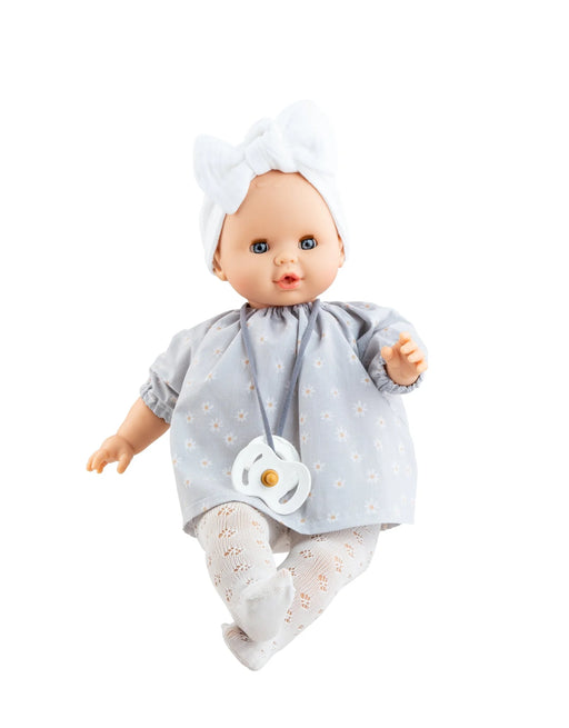 Baby doll wearing a gray floral outfit with a pacifier on a white background