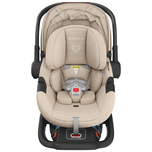 Beige UppaBaby Aria V2 infant only car seat with black frame on a white background