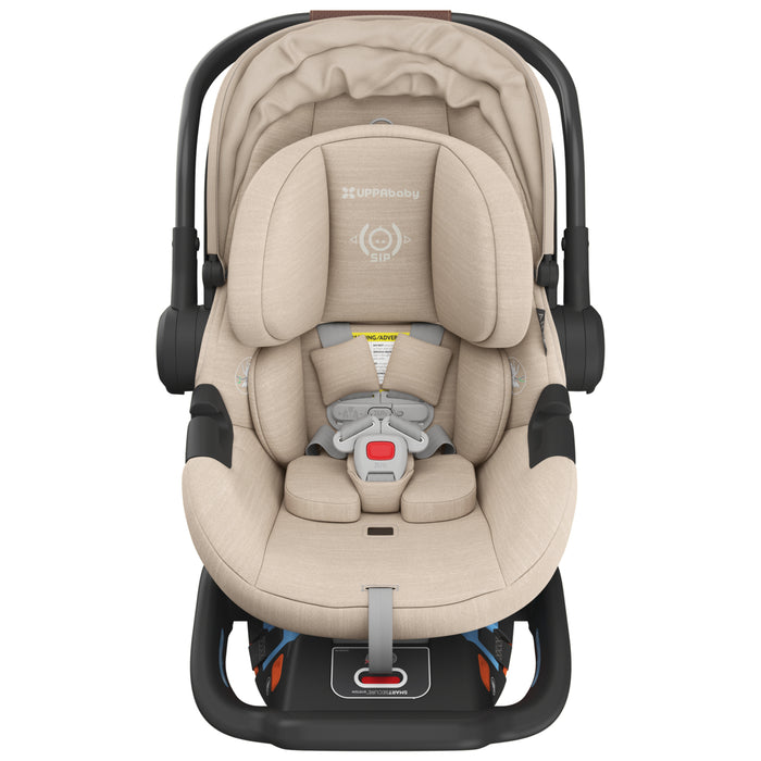 Beige UppaBaby Aria V2 infant only car seat with black frame on a white background