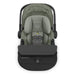 Green and black baby car seat with UPPAbaby branding on a white background