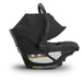 Black baby car seat with 'Aria' branding on a white background