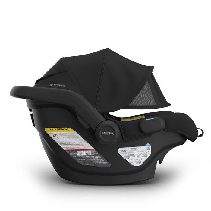 Black baby car seat with canopy on a white background
