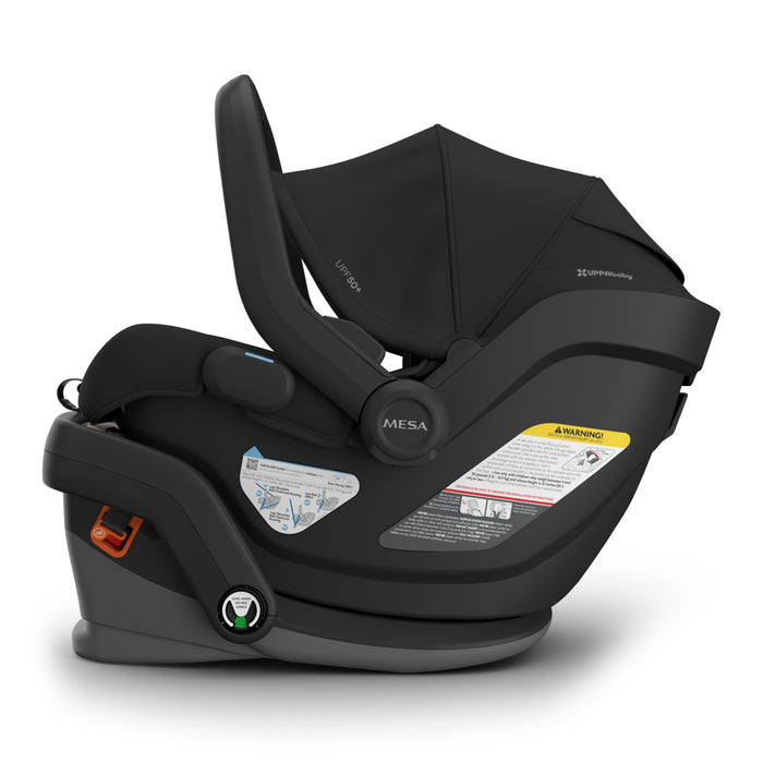 Black baby car seat with canopy on a white background