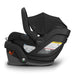 Black baby car seat with canopy on a white background