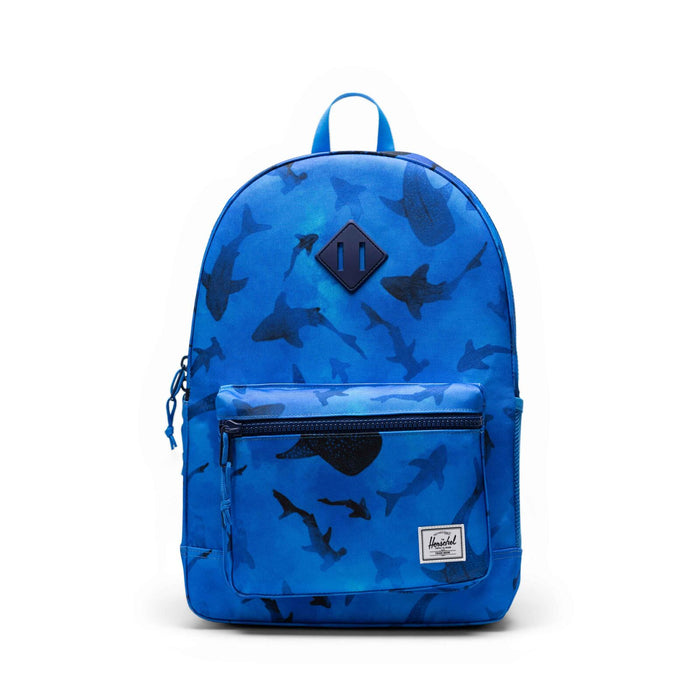Blue backpack with shark pattern on a white background