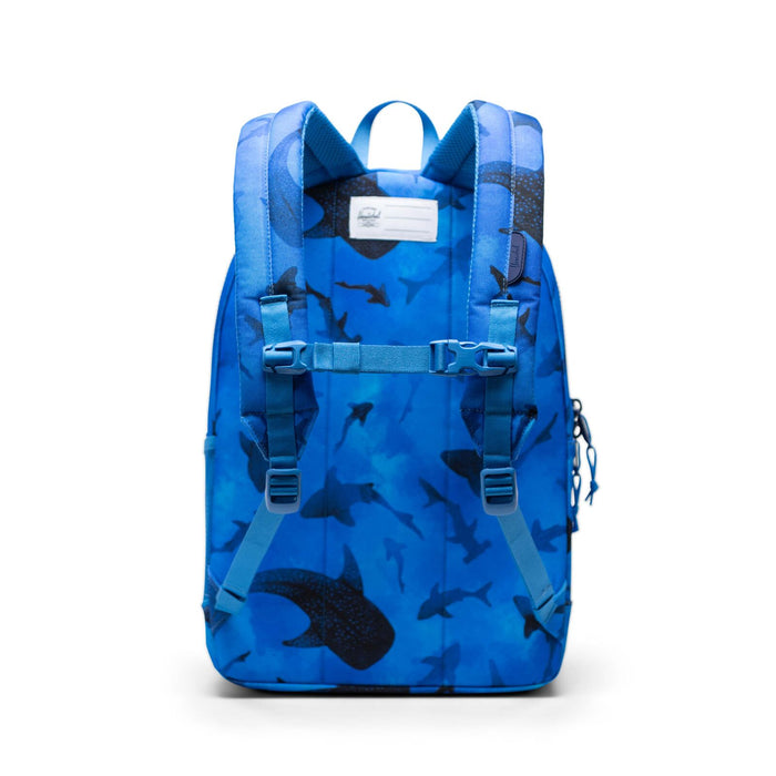 Blue backpack with shark pattern on a white background