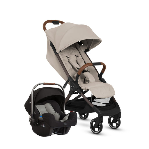 Beige stroller and car seat set on a white background