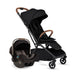 Black stroller with baby seat on a white background