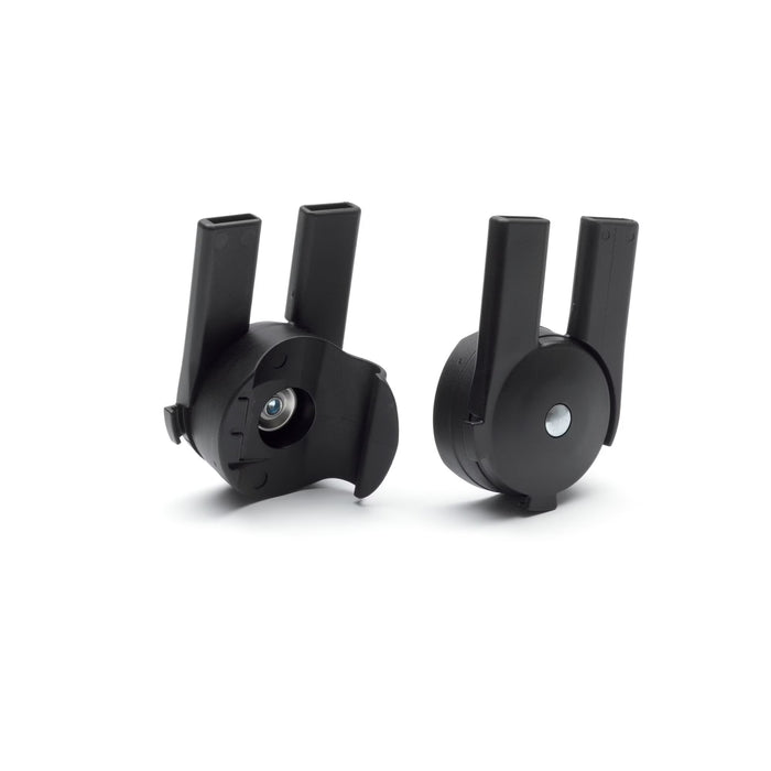 Two black mechanical components on a white background