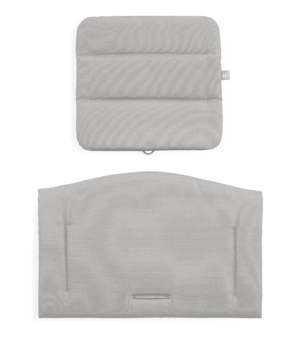 Two gray textured pillows on a white background