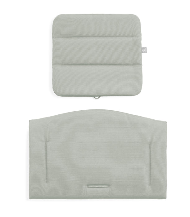 Two light gray textured pillows on a white background