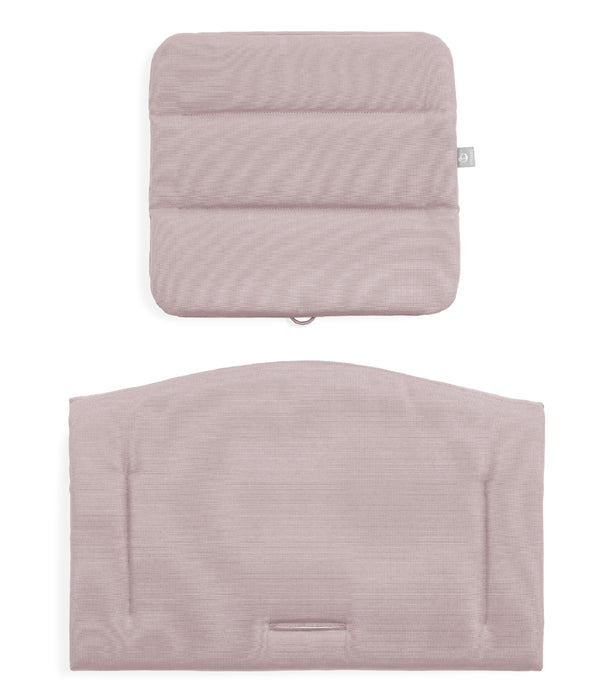 Two quilted cushions with a subtle pattern on a white background