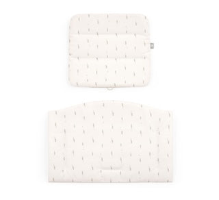 Two white woven mats on a white background