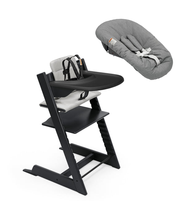 Black high chair with baby seat and gray cover on a white background