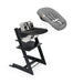 Black high chair with baby seat and gray cover on a white background