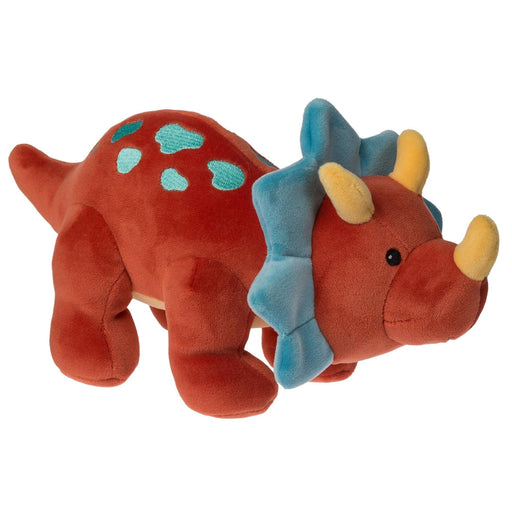 Plush toy dinosaur with blue spikes on a white background