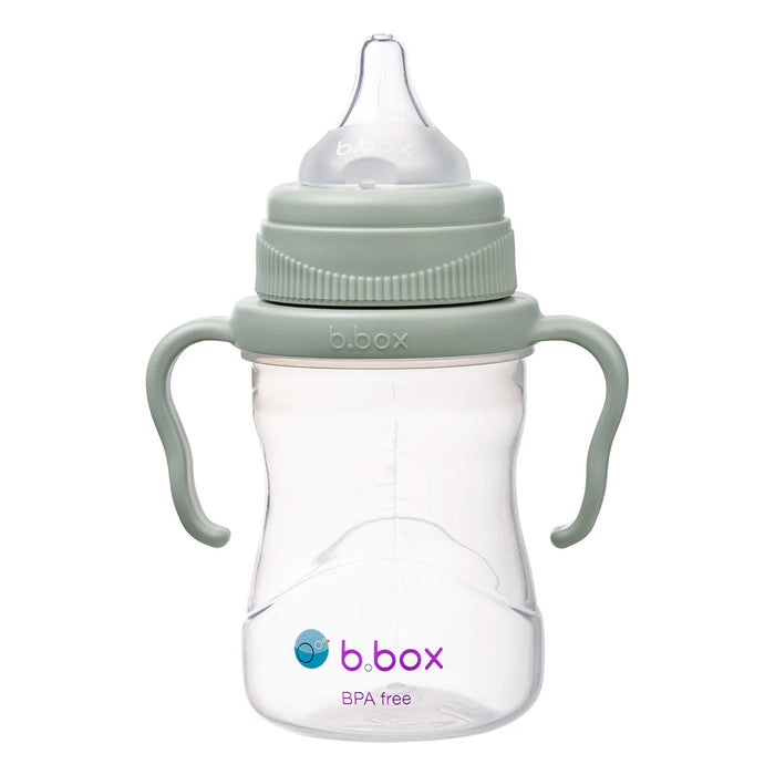 a green baby bottle on a white background