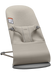 Beige baby Bjorn bouncer with 'Bouncer Bliss' branding on a white background