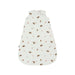 A sleeveless baby sleep sack with an all-over woodland print of hedgehogs, mushrooms, and small trees on an off-white background, shown flat against a white studio background.