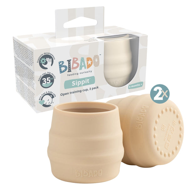 Beige training cups with packaging labeled 'BIBADO' on a white background