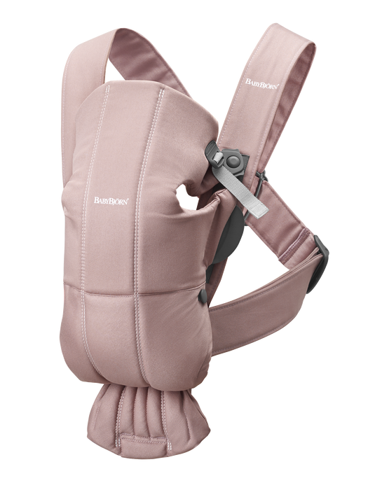 Pink Baby Carrier by Baby Bjorn to hold a young infant.