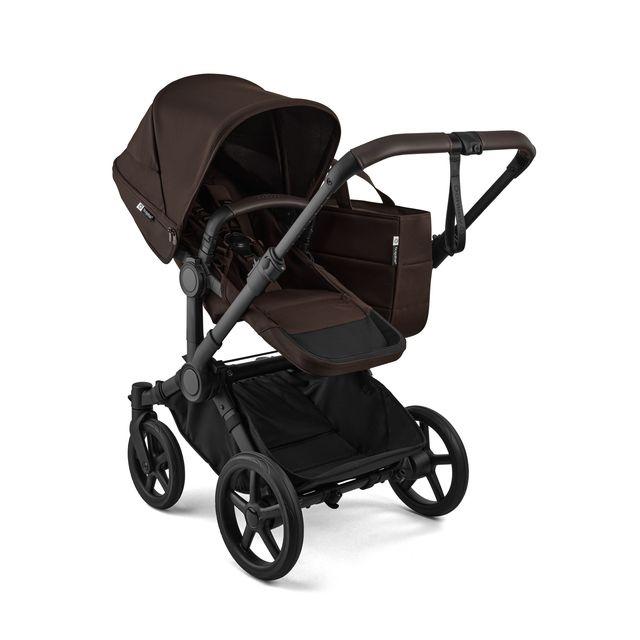 Brown and black stroller on a white background