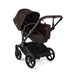 Brown and black stroller on a white background