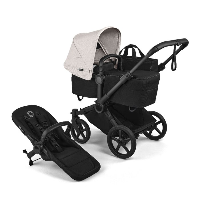 Black Bugaboo Donkey 6 Stroller with bassinet and stroller seat against a white background