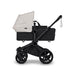 Black Bugaboo Donkey 6 Stroller with Misty White Canopy bassinet on a white background