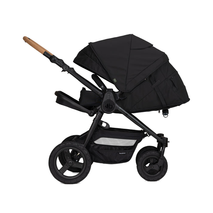 Black baby stroller with cork handle on a white background