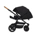 Black baby stroller with cork handle on a white background