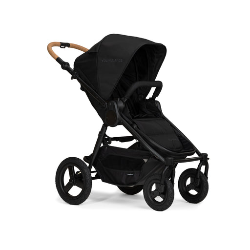 Black stroller with cork handlebar on a white background