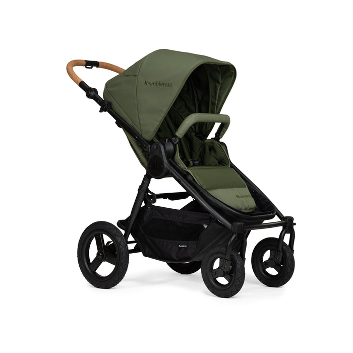 Green stroller with black frame and cork handle on a white background