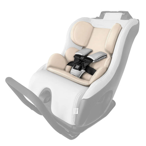a set of tan cushions for an infant to use in the clek foonf or fllo car seat against a white background