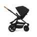 Black stroller with cork handle on a white background