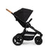 Black stroller with cork handlebar on a white background