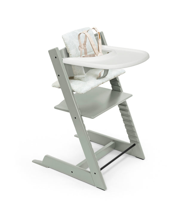 Muted Green wooden high chair with white tray and cushion on a white background