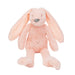 Pink plush bunny toy on a white background