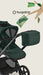 Green stroller with matching bag and 'bugaboo' logo  on a light background